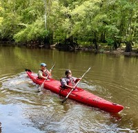 OSI staff paddle the Black River